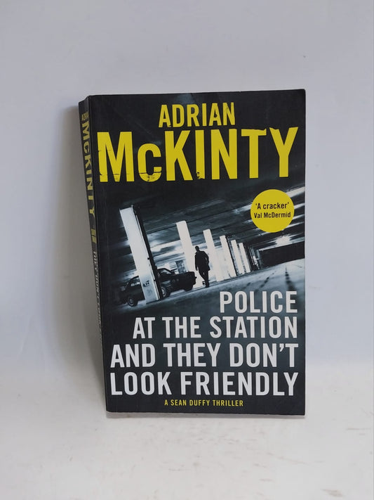 McKinty, Adrian - POLICE AT THE STATION AND THEY DON'T LOOK FRIENDLY